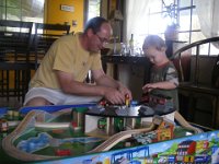 IMGP1092  A new table for my trains! Thanks Daddy! (I prevailed and we ended up buying the least expensive one :) It is wonderful - Sam loves the colors and space, especially the edges so trains don't fall off so easily.