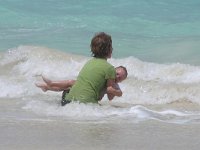 2007-03-27KailuaBchLunchTimeRomp (2)  He took a nose-dive into the sand and was COVERED so I'm trying to get the layers of sand out of his hair. He didn't want to clean up. He wanted to run and play in the water.