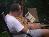 IMGP1734  Saturday morning reading in the yard with Daddy.