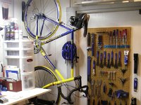 IMGP1964  Dave's bike workshop nearly completed. The bike has some new tires on it, and all the tools are within reach. He really enjoys keeping our gear all nicely stowed, clean, and in good repair. I have it pretty good. When I was raising horses, it was up to me to feed, clean, saddle. Now I can just ride out on my wheeled "steed" :)