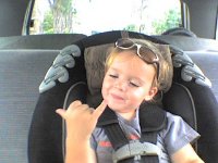 ATT00089  Shaka on the way to Lanikai Juice after a run. Gramma is giving us a ride :)