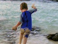 imgp3043  I love this shot - little buddy playing in the tide pools at Kailua Beach on Friday evening. We try to spend "aloha Friday" there during the late afternoon when the sun is less intense. Dave brings pizza to us when he gets home from work. This time it was actually chilly with the high winds. The little wetsuit is from Gramma Oli - she found it in NYC. He's holding his "big red car" in his left hand. So between the water and the car, he's got all his favorite items in reach!