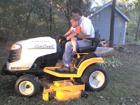ATT00046  Riding the new tractor with Tim!