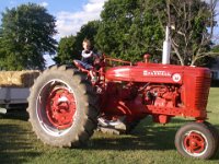 IMGP4569  The local farm produce stand has this tractor out for display. We couldn't resist. No hay rides this year. Too bad...