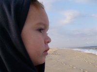 IMGP5356  Sammy checking out the Delaware beach. He was like...huh? It's cold! And the waves were loud, crashing right on the beach vs out further at the breaks like they do at home. He just stared for a long while.