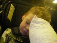 imgp4388  Finally on our way! We're in a KC-10 headed for McGuire AFB, NJ. It will be a 9 hr flight. It's 9:30am at takeoff. We'll land somewhere around midnight. Sam has his earplugs in for the nap, and is holding travel buddy "Bear" and clutching the patch one of the crew gave him. Behind him are some racks where the air crew will take a nap. They're like little bat caves. You'd look back and see a hand or foot sticking out from between the canvas flaps.