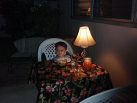 2008-01-19OutingWithGramma (6)  Dinner on Gramma's lanai. The lights are dim, so it's a "romantic" dinner! (He knows to talk softly, sometimes hold hands, and generally be sweet when out for a "romantic" dinner :) ).
