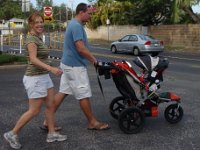 2008-06-08Bob'sPizzaKailua  Horrendous record shot of me before I regain my pre-pregnancy size. I'm 25lbs up. But losing weight rapidly! And I'm not even allowed to run yet! See the double jogger...oh yeah. Ready to get that rolling faster than a walk...my birthday is Tues (6/17), and on Wed it's 4 weeks postpartum so I am allowed to run. Ok, jog first.
