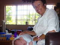 P6120015  Mom doing her magic on Ben to get him to wind down for a nap.