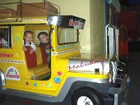 2009-03-03Children'sDiscoveryCenter  Sam giving Ben a ride in the Jeepney :)