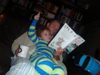 P3140025  Reading "Storms and Hurricanes" with Daddy. Sam is a born scientist. He wants to know all about everything. This is a pretty dense book, but he'll ask for specific pages and make sure you don't miss a word. He doesn't care that it's not a "story."
