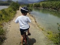 ATT01084  Here's my big guy biking aaaallll the way around the fish ponds - just over 4 miles. I was pushing Ben in the single. We had a great time! Some good challenges for him to grow into on this trail, but overall just the right kind of mountain biking experience for him.