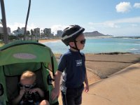 P7160013  Out on a fun run at Ala Moana Beach Park. Sam rode his bike while I pushed. That's Diamond Head in the background.