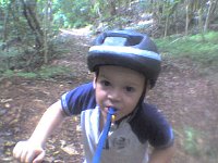 ATT00472  We're checking out a new trail - Maunawili Ditch Trail - for mountain biking/trail running. We had such a great time! The trail is 3 miles long, in a loop, so we got a lot of good riding in. It was pretty much like you see behind Sam most of the way, so very doable for a young biker and me pushing Ben in the stroller. There were some tricky sections and places we needed to walk, though. Lots of birds to listen to. Sam was so psyched to be out front biking on the trail.