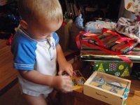 PC250153  Ben studying his new puzzles.