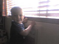 ATT00594  At the "winno" in the morning saying "Daddy! Daddy!" - Daddy is at work again. It's groundhog day here! No days off in 3 + weeks and counting. But hey, he's not deployed! He doesn't even have duty nights...darn! ha ha...Kidding! We are blessed.