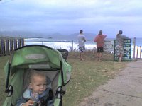 ATT01112  Out on a jog, looking for big waves. Surfers are watching the breaks and talking story. We might have had to do a little off-trailing to get here but we won't disclose exactly how. Suffice to say a road was closed and mommy doesn't like backtracking very much ;)