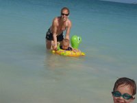 PC150091  Sam really enjoys the water after so much time away from the beach this year. Ben is not so sure about the floaty turtle...