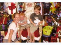 Santa visit2  Oh boy...Ben was quiet and studying Santa for a minute so I thought I'd try to do the picture. See the reaction? Poor Benji! He recovered quickly and started saying "Santa" tentatively. He is huge - as tall as the 3 yr olds we ran into there. Makes you think he's older than he is - but sometimes I'm reminded he's still a little guy.
