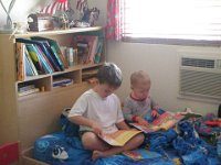 P1010004  Those two boys are so precious! There are moments when they like each other :) Ben is really into "reading" now.