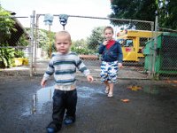 IMGP0350  After a workout at the Y, the boys jumped in some puddles and had a fabulous time. Ben's pants are SO wet you can see he's losing them. Look at Sam's face! Funny boys :)