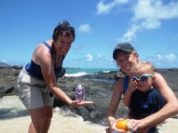 IMGP1314  A new friend we happened to meet at the tide pools took this picture of mom helping take care of me while I peel Ben's orange for him :)