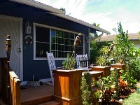 IMGP1627  And day 2 - doing the deck. I sanded and stained all morning. Looks much much better now. Those rocking chairs really beckon!