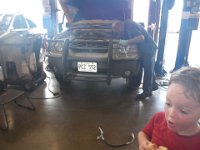 IMGP1709  Yay! The AC is fixed!!!! That's Jason, the mechanic I'd been haunting for a week trying to figure out when we should get in. We had to run to the Nissan dealer, grab a part, then call Jason at the Hickam auto hobby shop on our way back to say "OK! I have the part! You can rip the old one out now, we're on our way back!" so that we'd get it all done before the shop closed for lunch. What a wild morning. We were up at dawn just to get this done, but we saved $600 dollars doing it this way vs the guy down the street.