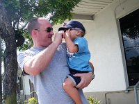 IMGP2019  Daddy out with Ben - showing Mary F. how he has almost outgrown his Habianas slippers. We'll have to bronze them! Thank you for those - they have long been a favorite of his. He likes to make sure he has his hat, slippers and glasses before heading out to "da twuck."
