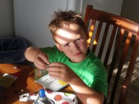 IMGP2713  You know where he got this face! He's building a new "cottage Lego set" - a cheap Long's one :)