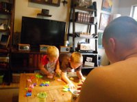 IMGP0132  The boys playing nicely one weekend morning. It's a dino puzzle with numbers! Ben's job is to put the 1s in their places.