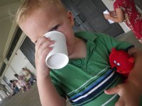 IMGP3016  Ben at church with "Mr. Purrfect", who Ben helps to behave at church. Donuts and lemonade afterwards for good boys. :)
