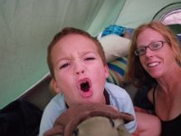 IMGP0441  More morning funny faces! This is a tradition to catch the groggy looks. They were very naughty going to sleep - I say naughty loosely. Mommy was tired and wanted to go to sleep but they kept laughing and doing "Ben-80s" (thumping feet on bed to sound like an M80 going off). Sam says if I ignore them they will quiet down more quickly. I will try giving them their own side of the tent next time and I will cordon myself off in my own mommy area!