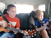 IMGP0299  Driving to Sam's uke lesson...playing ukes to Eddie Kamae, on the uke Eddie gave Sam! It's his new favorite - it's a concert uke, so we take very special care of it, but he loves to play it so much now that he's grown into it that it's hard to get him to play on his practice uke.
