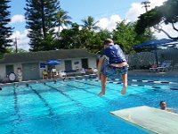 IMGP0304  Towers pool - learning to bounce then jump and grab knees. Ben actually went off the diving board, too! He went twice, then decided it was too spooky!