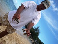 IMGP0552  Huge crabbies! You can find these in the sand if you look for large holes and dig in to find them sleeping during the day, trying to stay out of the heat. This man grew up on the Big Island, so he kindly taught us what he knew about how to catch these guys.