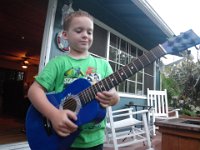 IMGP0570  Sam has been so very happy to have a guitar to play as well as his uke. He is very good about alternating instruments despite being enchanted with his guitar. He has been playing uke while Dad plays guitar at night in the "studio" but now they can both play the same chords.