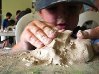 IMGP1326  Ben making a "bolcano i-wand" - volcano island. He really really enjoyed the clay. Tasted some of it. Hands all over the place. Very quietly working along with Sam, then going up to the table for directions, finding his way back to his own chair. I was very impressed. PlayDoh is nowhere near this cool somehow.
