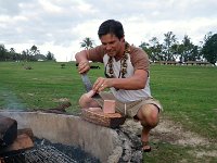 IMGP2146  Now that the damp kiawe fire is started thanks to Doug's skill, we are ready to roast our beast. Doug is hacking our SPAM with my machete!