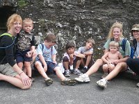 IMGP1810  Here we are at the top - at the ancient snack bench :) Three pictures because it took that many to get everyone to look. The kids like to scatter like little rodents once they've had a snack. They were starting to climb the walls...literally! So we coralled them and started herding them down the trail. The momentum downhill carried them, but we were worried someone would really wipe out. Usually there's some blood on the trail, but this time no one got hurt or blown over! Amazing!