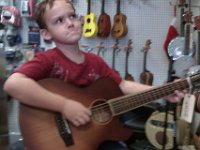 IMAG0034  Buying Daddy his Christmas present...Sam gets his hands on a 12 string...