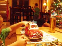 IMGP1692  Showing Baby Jesus the fire truck (Jesus in Ben's right hand). He was very bossy to Baby Jesus. "No! You don't get in there! You get in HERE!"