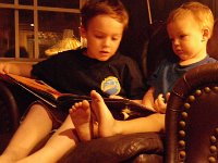 IMGP2495  Reading "Rain School" to Ben. It's about a school in Chad (Africa) - the kids have to build their own school building each year because the monsoon rains wash it away between sessions. They have a one-room schoolhouse. Sam read the whole book to Ben. Very sweet - he did this on his own. There are not a lot of sweet moments between them...so this was really cool to see. (Meaning there are a lot of very typical brother interactions between them!)
