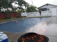 IMGP3010  Mommy decided boys should have a bbq pool party and invited some friends and Gramma. When the rain came, everyone figured surely mommy would have sense enough to call it off. But we were already at the pool with all the stuff, so the party went on despite pouring rain! I read clouds pretty well so I figured I'd wait it out holding the grill cover over the flames until the rain subsided a bit.