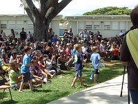 2011-05-25KindergartenGraduationKainalu (4)  Sam going up to put a lei on a 6th grader.