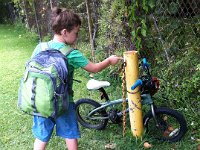 2011-05-26LastDayKindergarten  Getting his bike for the last time after school.