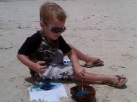 IMAG0464  Painting with mommy on the beach while Sam swims with Gramma.