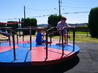 IMGP4121  Visiting a favorite playground. They LOVE this merry-go-round!