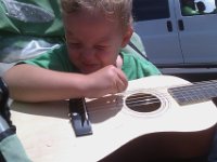 IMAG0555  Jammin - all 6 six strings on his guitar now! Ben jammed all the way home in the stroller while I ran and Sam biked. Yes, we got some funny looks but he was playing nicely!