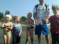 IMAG0775  And started digging some more when we were told that the little hole in the sand was a geoduck! The mom poked it and it squirted! Like 3 ft in the air! I jumped and screeched! I was so surprised! The boys loved it! So we decided we'd dig for one. We were not going to be outdone. So all the kids and I were digging furiously while the native (the mommy) watched and was probably thinking we'd never get it. Takes a long time. But my guys liked to dig. And we all have a big determined streak in us...